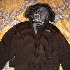 brown North face puffy jacket
